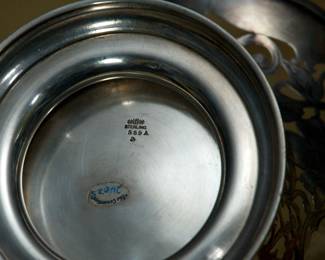 Closeup of very large antique sterling silver pierced basket with swing handle; Birmingham, England makers mark