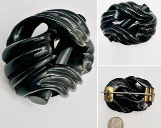 Antique brooch made from Whitby jet carved and polished in a buckle form, sterling silver pin attachment on the back, unmarked.