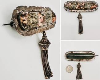 Large sterling silver 19th century antique Scottish brooch featuring moss agate and granite set in a fluted and engraved sterling silver setting with metal pin and attached ornate silver tassel.
