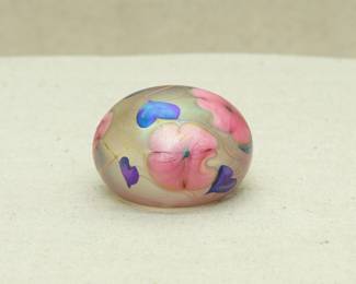 Another view of the Charles Lotton art glass paperweight, Multi Flora design, base with engraved signature, 1977, and #1/300
