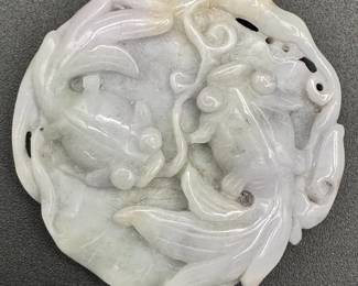 A Chinese carved jade piece, pale lavender/gray, of two goldfish swimming above a lily pad