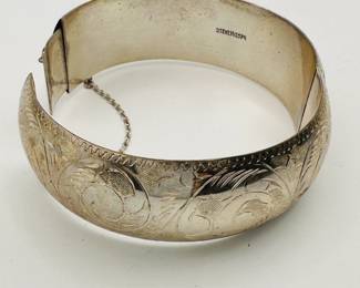 A lovely old sterling silver engraved bracelet with safety chain