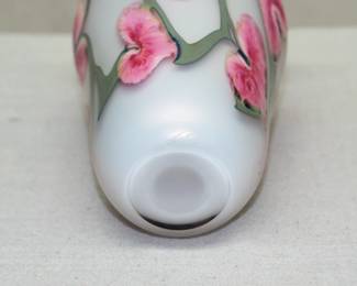 Closeup of an art glass vase by John Lotton, cased glass with Pink Hearts floral design over white iridescent ground. Signed and dated 1991.