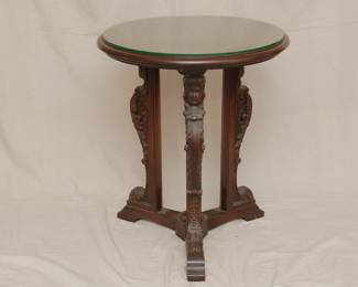 A Neoclassical style side table with figural legs