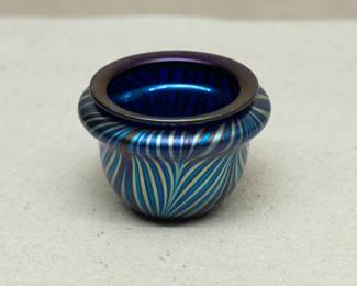 A Charles Lotton art glass vase, pulled feather design over a rich dark blue, iridescent glass, signed
