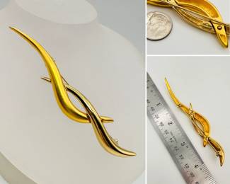 A graceful Givenchy gold tone brooch/pin