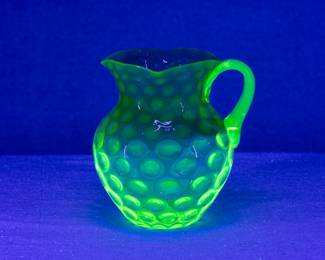The Hobbs, Brockunier, and Company Inverted Thumbprint Rubina Verde pitcher, ca. 1880s seen under black light.