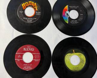 45 RPM records including 'Get Back' by the Beatles, and 'Bring It Up' by James Brown & The Famous Flames