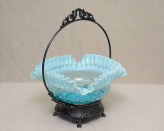 Antique 19th century blue opalescent ruffled glass brides bowl with silver plate frame, the frame showing repoussé designs and paw feet, and marked Quadruple Plate National S.W.