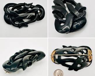 Antique sterling silver and Whitby jet brooch, mid to late 19th century, fluidly carved and highly polished. Popular as mourning brooches, particularly after the death of Prince Albert, when Queen Victoria insisted that Whitby jet was the only jewelry to be worn at court during the official mourning period.