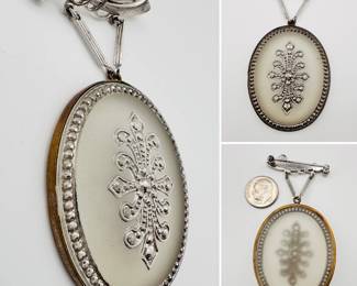 A vintage sterling silver and camphor glass brooch