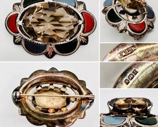 Antique Scottish pebble jewelry style sterling silver brooch, late 19th century, oval shape engraved silver frame with half moon shape panels of bloodstone, red jasper or carnelian, and blue agate, with a large faceted smokey quartz central stone in claw setting. Marked sterling silver to the back with hallmark stamps for silversmith in Birmingham, England.