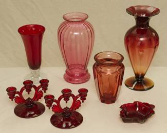 A vintage vintage 1940's Fostoria No. 2470 Ruby clear footed vase designed by George Sakier, a Moser crystal "Eternity' Rosalin color vase, a Pilgrim Glass Cranberry Collection ribbed vase, a pair of New Martinsville Glass Company Moondrops three-light candlesticks in ruby glass (elegant / depression / art deco glass!), a vintage Anchor Hocking ruby red maple leaf shaped candy or nut bowl