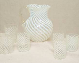 A Fenton or Northwood opalescent swirl glass pitcher with six matching tumblers