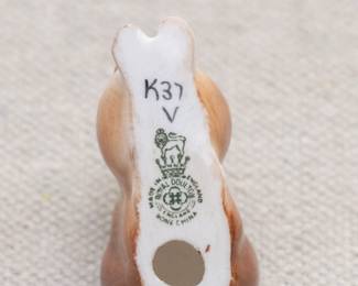 A Royal Doulton rabbit figurine, and a Royal Doulton flambé glaze rabbit figurine