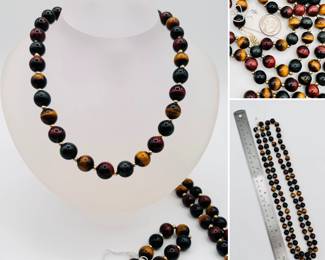 A long necklace of beautiful 'Tiger's Eye' quartz beads with 14k gold clasp