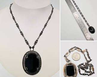 Art Deco vintage necklace with oval black stone pendant in a silver and marcasite frame, suspended by delicate floral silver and marcasite links