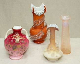 A Harrach Glassworks peachblow art glass vase of twin handle moon flask form, in cased uranium glass with enameled butterfly & blossom decoration; a Stevens & Williams art glass vase of cased orange and white uranium glass with applied clear rigaree feather-like decoration and ruffled crimped rim, a beautiful antique Stevens & Williams cased opaque matt finish uranium glass vase, shading from pale ivory to warm cinnamon, with applied flowering vine decoration frosted rigaree glass; and a Nailsea style opalescent pulled drapery design uranium glass vase