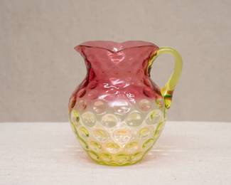 Uranium glass: A Hobbs, Brockunier, and Company Inverted Thumbprint Rubina Verde pitcher, ca. 1880s