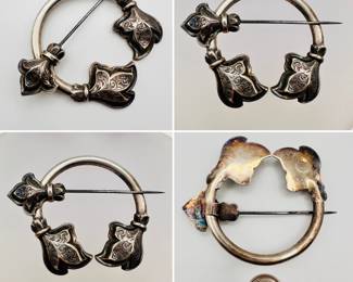 Antique Scottish brooch, sterling silver pennanular cloak or shawl pin with formed and engraved leaves at the ends of the ring, the pin attached with a fleur-de-lis. Unmarked. The French symbolism on this Scottish brooch likely signifies the 'Auld Alliance' of Scotland and France through the centuries – Scottish soldiers served within the French army; there were reciprocal dual nationality agreements, and many Scots studied at French universities, something which continued up until the Napoleonic Wars.