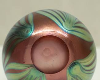 Closeup of the Charles Lotton art glass vase, pulled feather design of iridescent gold green over a warm copper ground; signed and dated 1987.