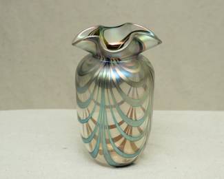 A beautiful handblown art glass vase by John Lotton, clear glass with iridescent pulled waves of color and a flared waved rim. Signed and dated 1989.