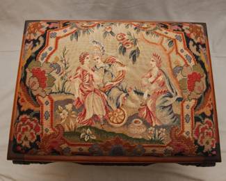 Another view of the Georgian style carved wood and needlepoint covered bench, with carved apron; cabriole legs resting on ball and claw feet