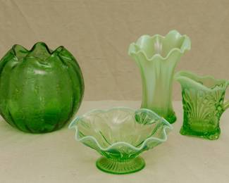 A vintage Bohemian art glass hand blown green crimped and enameled rose bowl, a vintage Northwood green opalescent swung glass Feathers pattern vase, a vintage 1910-era art deco Northwood Glass Co. green opalescent Roulette pattern footed bowl with ruffled high crimp rim, and an EAPG Jefferson Glass Co green opalescent "Tokyo" or Fan and Dot pattern pitcher circa 1907.