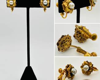 A pair of vintage signed Miriam Haskell gold tone and Faux Pearl blossom form clip earrings