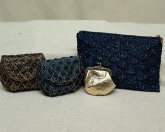 Three vintage beaded clutch purses / evening bags and a metallic leather/fabric coin purse with metal clasp frame