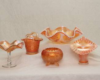 Vintage carnival glass including a Fenton iris pattern marigold carnival glass compote, a vintage Dugan or Fenton carnival glass basket, a Dugan Glass jeweled heart ruffled Bowl, opalescent peach, with beaded edge; a Fenton Glass marigold color carnival glass footed rose bowl, and a Fenton marigold carnival glass Jack-in-the-Pulpit vase