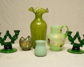 A pair of Cambridge #3400 emerald green glass keyhole triple light candle holders, an antique Dugan Glass striped frit glass pinched vase or rose bowl in Pompeian Green, an olive green hand blown overshot crackle glass vase with ruffled flared rim, a green swirled two-tone green art glass pitcher with hand-painted floral decoration and applied clear green glass handle, and a New England Glass Co. small green opaque art glass vase, satin finish; fourth quarter 19th century.