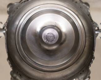 Base of the stand showing mark from E. G. Webster Bro N.Y., Quadruple Plated Hard White Metal, with a stamped numeral 86. Webster operated under this particular name (E.G. Webster & Bro) for only a short span of years from 1873 - 1886, so this piece dates to the Gilded Age in New York.