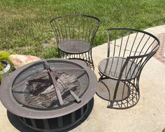 Outdoor Fireplace and 2 Metal Chairs