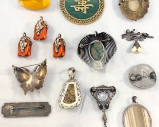 Another view of the vintage charms, pendants and brooches – several are sterling silver