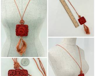 Stunning statement necklace - a vintage Chinese cinnabar lacquer pendant, finely carved with a dragon on one side and Chinese characters and flowers on the other; on a silk cord with decorative knot and tassels