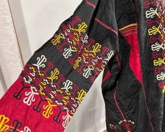 Closeup of the rare vintage Turkmenistan embroidered silk tribal coat, handmade