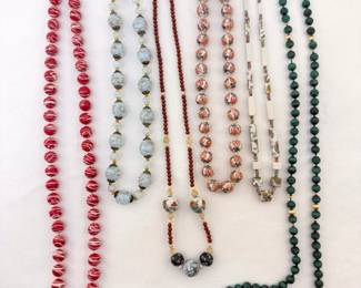 A variety of vintage beaded necklaces, some with sterling silver clasps