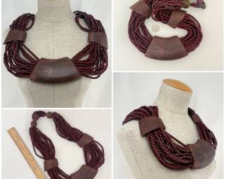 Dramatic tribal style necklace of multiple strands of beads and snakeskin texture elements