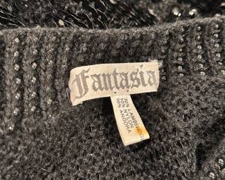Closeup of Vintage Fantasia black wool beaded sequin evening jacket or sweater