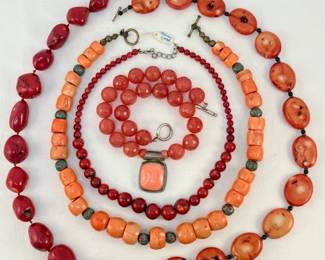 Beaded choker length necklaces in red and orange shades
