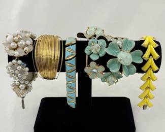 So many styles of bracelets...flower form, enamel, Faux Pearls, fine wire, geometric shapes