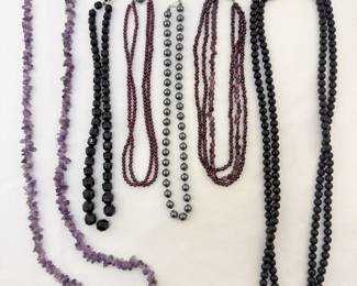 A variety of vintage beaded necklaces, some with sterling silver clasps