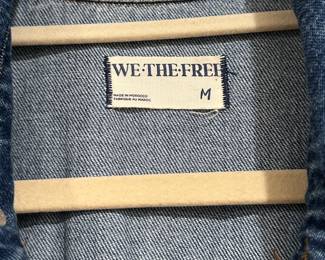 Closeup of We The Free Marci denim shortsleeved jumpsuit by Free People, size M