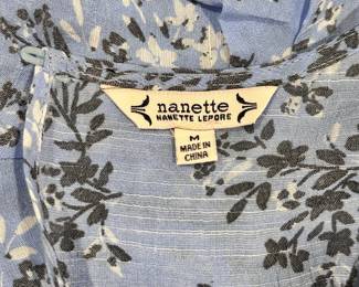Closeup of Nanette Lepore blue floral pattern long sleeve shirt, size M