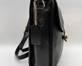 Vintage COACH Scout black leather crossbody handbag, authenticated by Entrupy