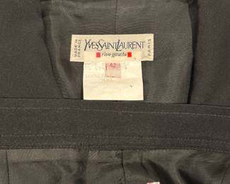 Closeup of vintage Yves Saint Laurent black wool suit, made in France; jacket size 10, skirt size 12