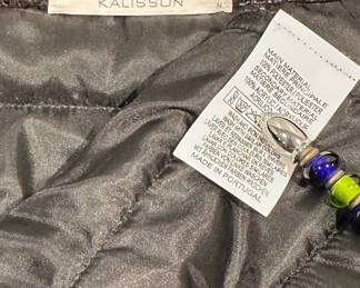Closeup of Kalisson slim fit colorful jacket with black sleeves, zip front; size M
