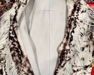 Closeup of the white leather patterned jacket/blazer, probably a size 10/12