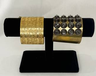 Rare vintage Miriam Haskell wide cuff bracelet, gold tone with intricate floral pattern, safety chain; and a wide cuff bracelet with riveted studs